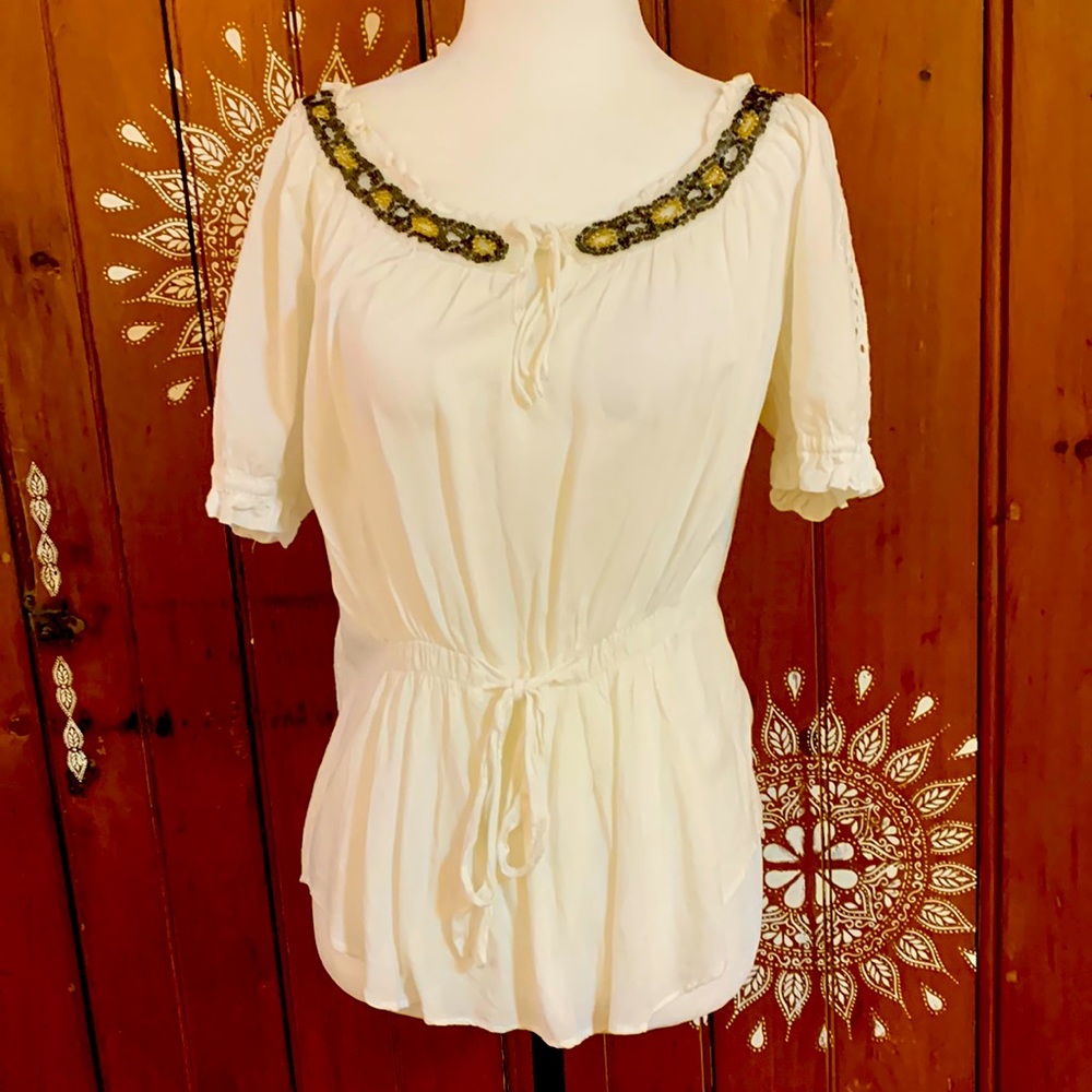 Pretty white top with beaded neckline.